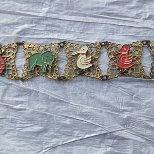 Metal Filigree Bracelet With Enamel? Animals/figures.